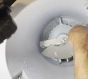 closeup of technician installing a baffle on Symphony Plus 12 Series dispenser