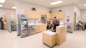 Nursing station on patient floor with two nurses at a desk